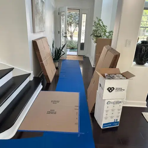 Moving supplies including boxes, tape, and bubble wrap